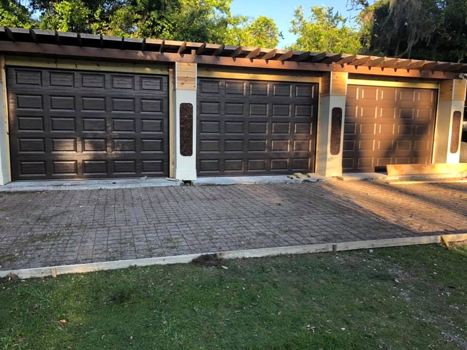 Three black garage doors after installation